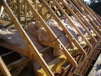 450mm of fibreglass over the wall plate area before felt and batten.